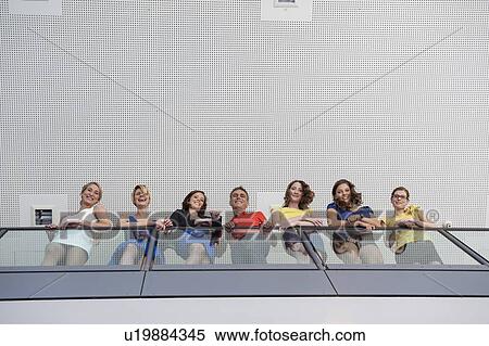 Business people standing on balcony View Large Photo Image Stock Photography - Business people standing on balcony. Fotosearch