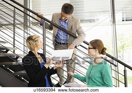 Business people talking in office View Large Photo Image Picture - Business people talking in office. Fotosearch