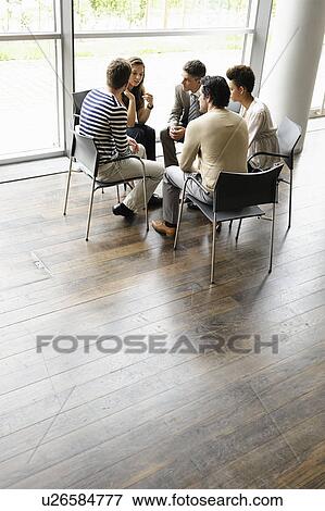 Business people talking in office View Large Photo Image Stock Photo - Business people talking in office. Fotosearch