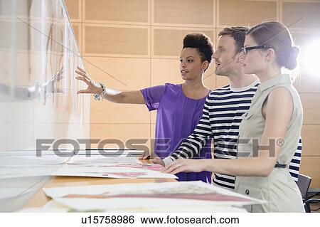 Stock Photograph - Business people talking in office. Fotosearch