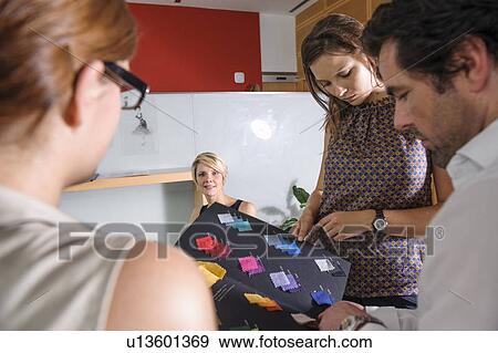 Stock Photo - Business people with fabric swatches. Fotosearch