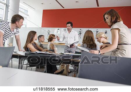 Stock Photography - Business people working in office. Fotosearch