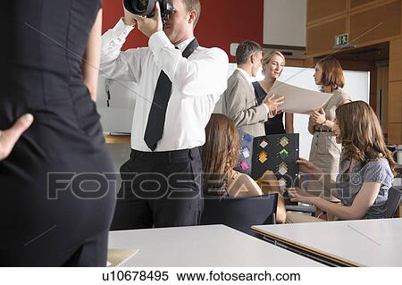 Stock Photography - Business people working in studio. Fotosearch