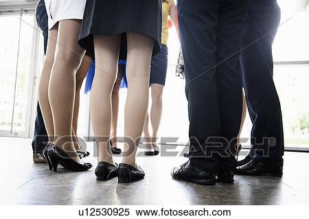 Business peoples legs in office View Large Photo Image Stock Photography - Business peoples legs in office. Fotosearch