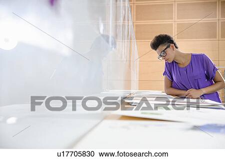 Businesswoman working in office View Large Photo Image Stock Image - Businesswoman working in office. Fotosearch