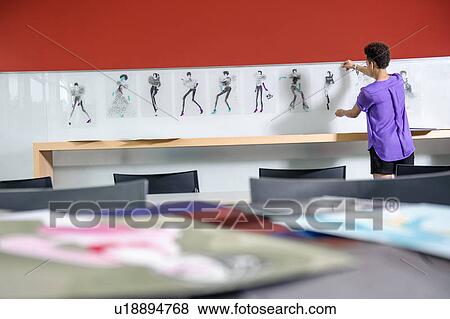 Stock Photo - Businesswoman working in office. Fotosearch