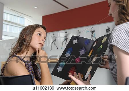 Businesswomen examining fabric swatches View Large Photo Image Stock Photo - Businesswomen examining fabric swatches. Fotosearch