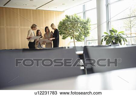 Businesswomen talking in cafeteria View Large Photo Image Stock Image - Businesswomen talking in cafeteria. Fotosearch