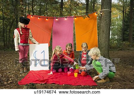 Picture - Children selling self-made drinks. Fotosearch
