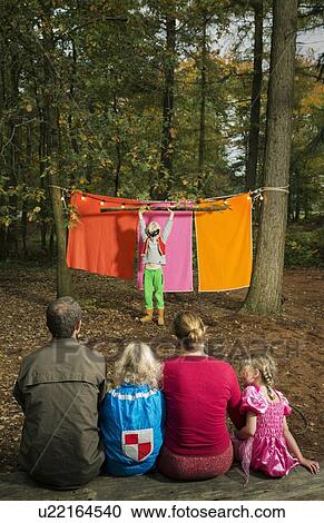 Stock Image - Childrens theater improvised in woods. Fotosearch