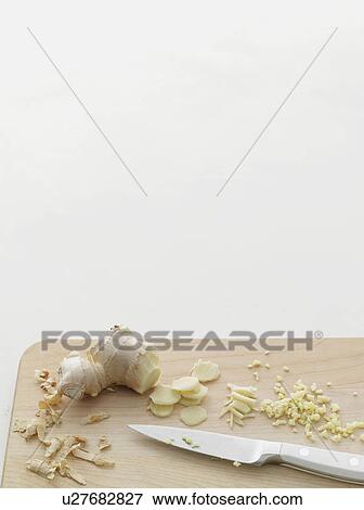 Stock Photo - Chopped ginger on cutting board. Fotosearch