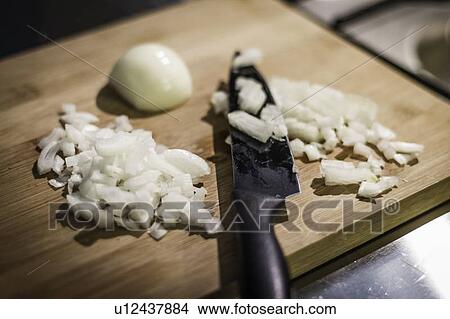 Chopped onions on cutting board View Large Photo Image Picture - Chopped onions on cutting board. Fotosearch