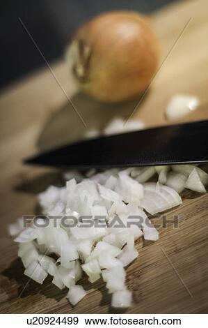 Chopped onions on cutting board View Large Photo Image Stock Photo - Chopped onions on cutting board. Fotosearch