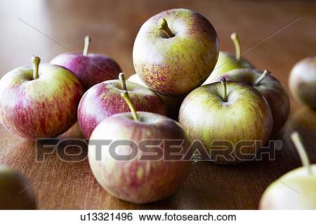 Stock Photograph - Close up of apples on table. Fotosearch