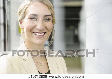 Close up of businesswomans smiling face View Large Photo Image Stock Photo - Close up of businesswomans smiling face. Fotosearch
