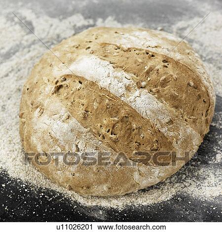 Close up of fresh baked loaf of bread View Large Photo Image Stock Image - Close up of fresh baked loaf of bread. Fotosearch