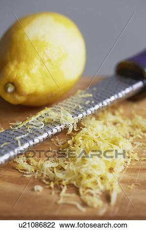Stock Image - Close up of grated lemon peel. Fotosearch