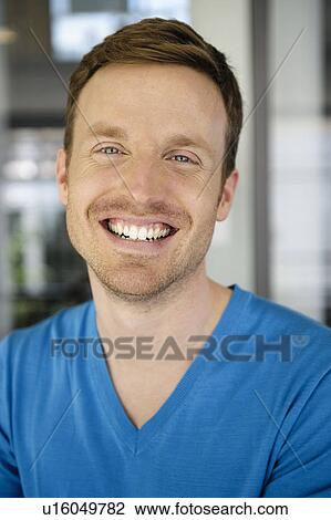 Stock Image - Close up of mans smiling face. Fotosearch