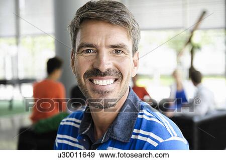 Stock Photo - Close up of mans smiling face. Fotosearch