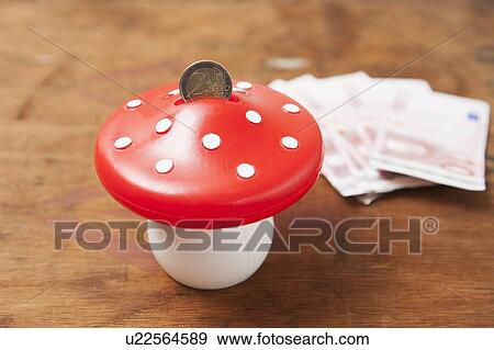 Close up of mushroom savings bank View Large Photo Image Stock Photo - Close up of mushroom savings bank. Fotosearch