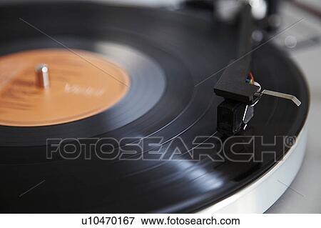 Close up of needle playing record View Large Photo Image Stock Photo - Close up of needle playing record. Fotosearch