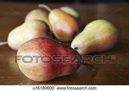 Stock Image - Close up of pears on table. Fotosearch