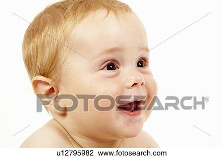 Stock Image - Close up of toddler boys smiling face. Fotosearch
