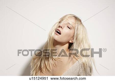 Close up of woman playing with her hair View Large Photo Image Stock Image - Close up of woman playing with her hair. Fotosearch