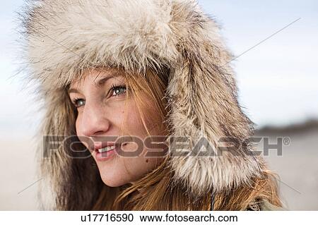 Close up of woman wearing fur hat View Large Photo Image Stock Image - Close up of woman wearing fur hat. Fotosearch