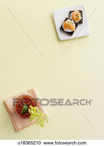 Cocktail with salmon and cheese crackers View Large Photo Image Stock Image - Cocktail with salmon and cheese crackers. Fotosearch