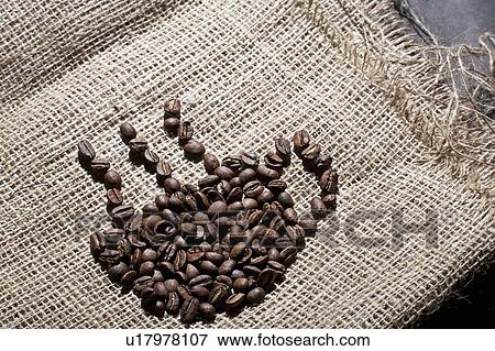 Stock Photo - Coffee beans in shape of cup. Fotosearch