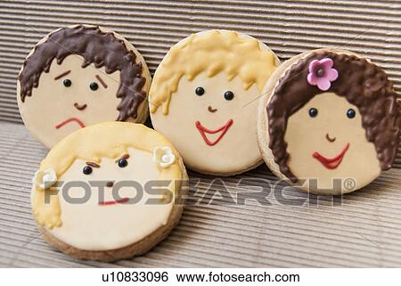 Stock Photograph - Cookies decorated with faces. Fotosearch