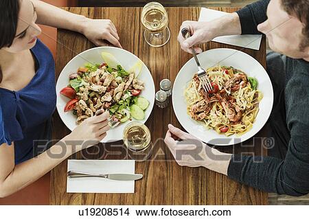 Picture - Couple having lunch at cafe. Fotosearch