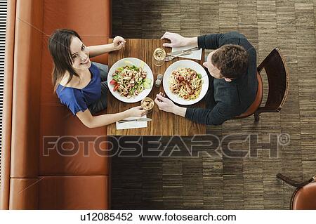 Couple having lunch at cafe View Large Photo Image Stock Image - Couple having lunch at cafe. Fotosearch