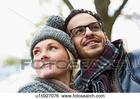 Stock Photograph - Couple hugging outdoors. Fotosearch
