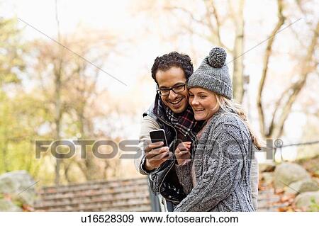 Couple taking picture of themselves View Large Photo Image Stock Photo - Couple taking picture of themselves. Fotosearch