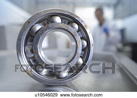 Stock Photo - Dirty part in ultrasonics cleaning lab. Fotosearch