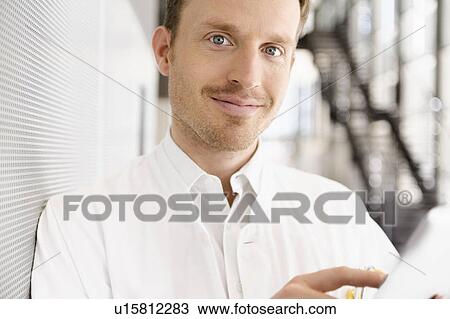 Stock Image - Doctor using tablet computer. Fotosearch