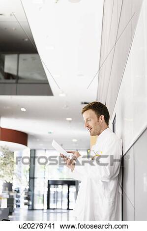 Stock Image - Doctor using tablet computer. Fotosearch