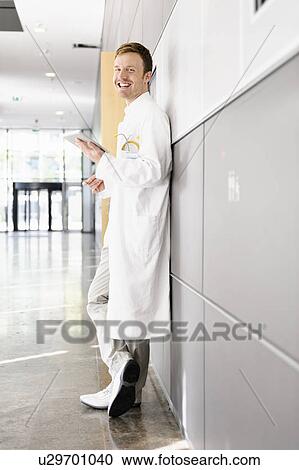 Stock Image - Doctor using tablet computer. Fotosearch
