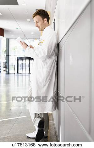 Doctor using tablet computer View Large Photo Image Stock Photo - Doctor using tablet computer. Fotosearch