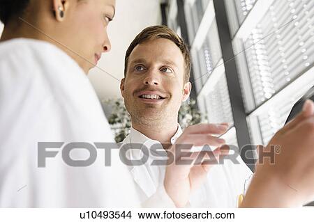Doctors using tablet computer View Large Photo Image Picture - Doctors using tablet computer . Fotosearch
