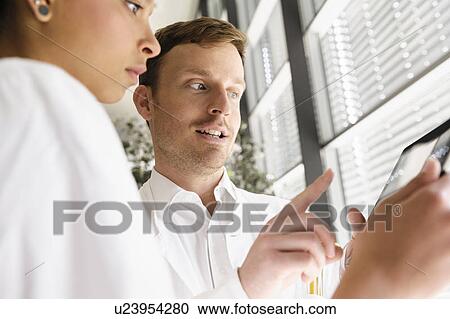 Doctors using tablet computer View Large Photo Image Stock Image - Doctors using tablet computer . Fotosearch