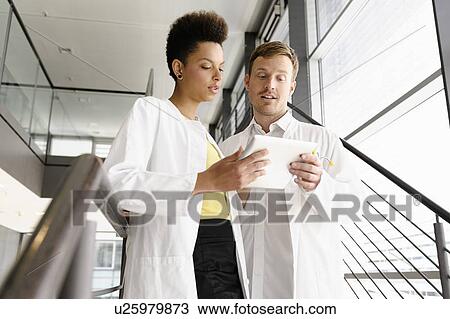 Doctors using tablet computer View Large Photo Image Stock Image - Doctors using tablet computer . Fotosearch
