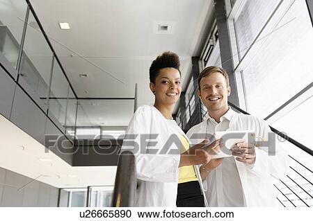 Doctors using tablet computer View Large Photo Image Stock Image - Doctors using tablet computer . Fotosearch