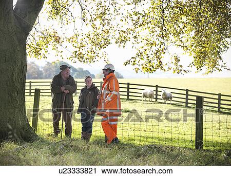 Ecologist and farmers talking in field View Large Photo Image Stock Image - Ecologist and farmers talking in field. Fotosearch