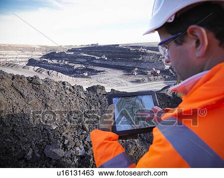 Ecologist examining surface coal mine View Large Photo Image Stock Image - Ecologist examining surface coal mine. Fotosearch