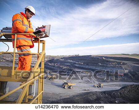 Ecologists examining coal mine site View Large Photo Image Stock Image - Ecologists examining coal mine site. Fotosearch