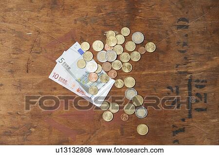 Euro coins and notes on table View Large Photo Image Stock Photo - Euro coins and notes on table. Fotosearch