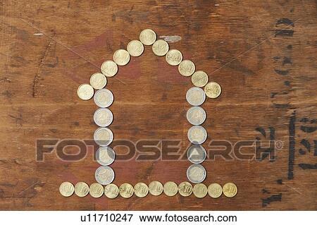 Stock Photo - Euro coins in shape of house. Fotosearch